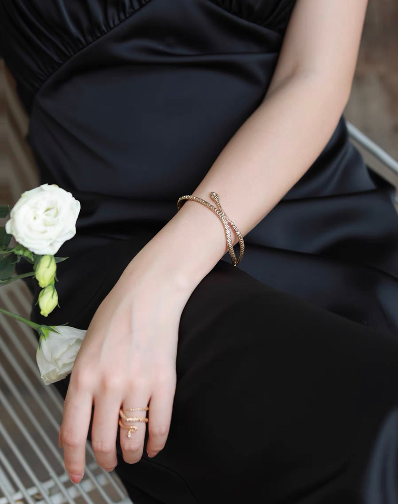 Gold snake entwined snake encrusted bracelet