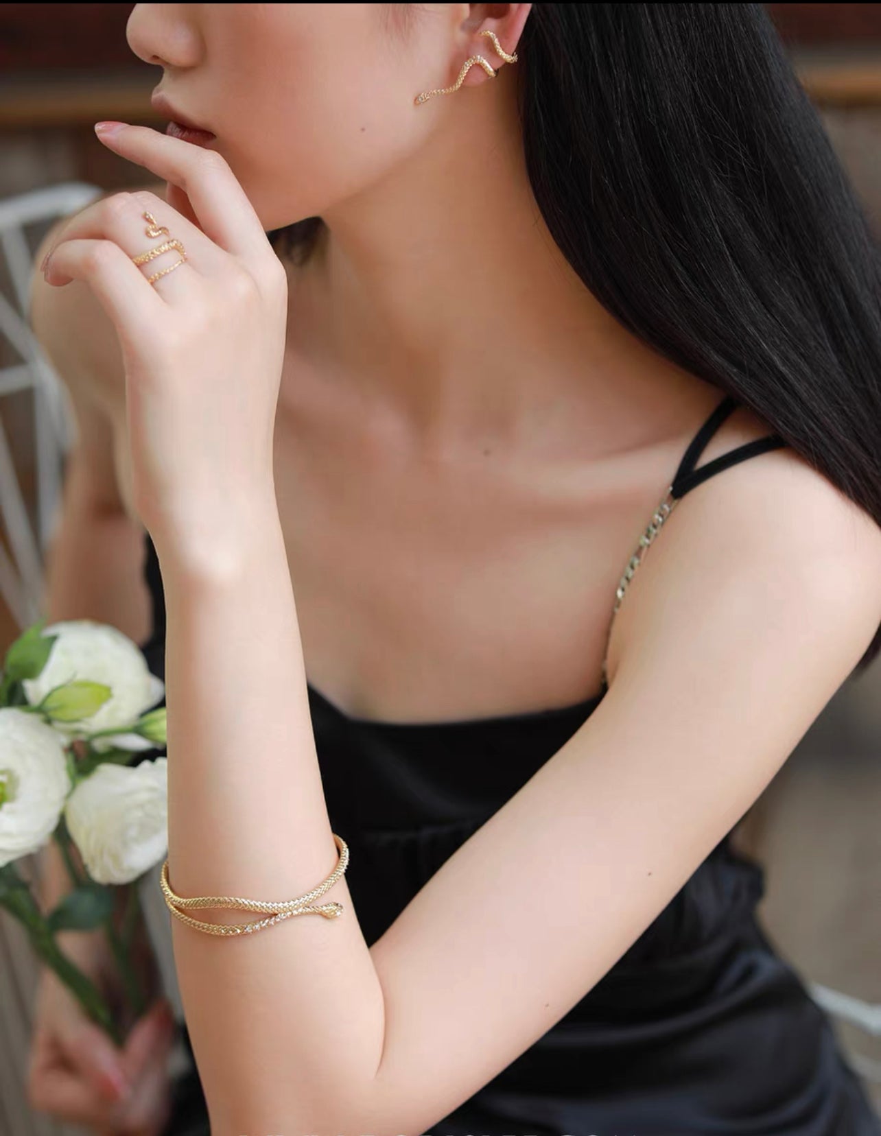 Gold snake entwined snake encrusted bracelet